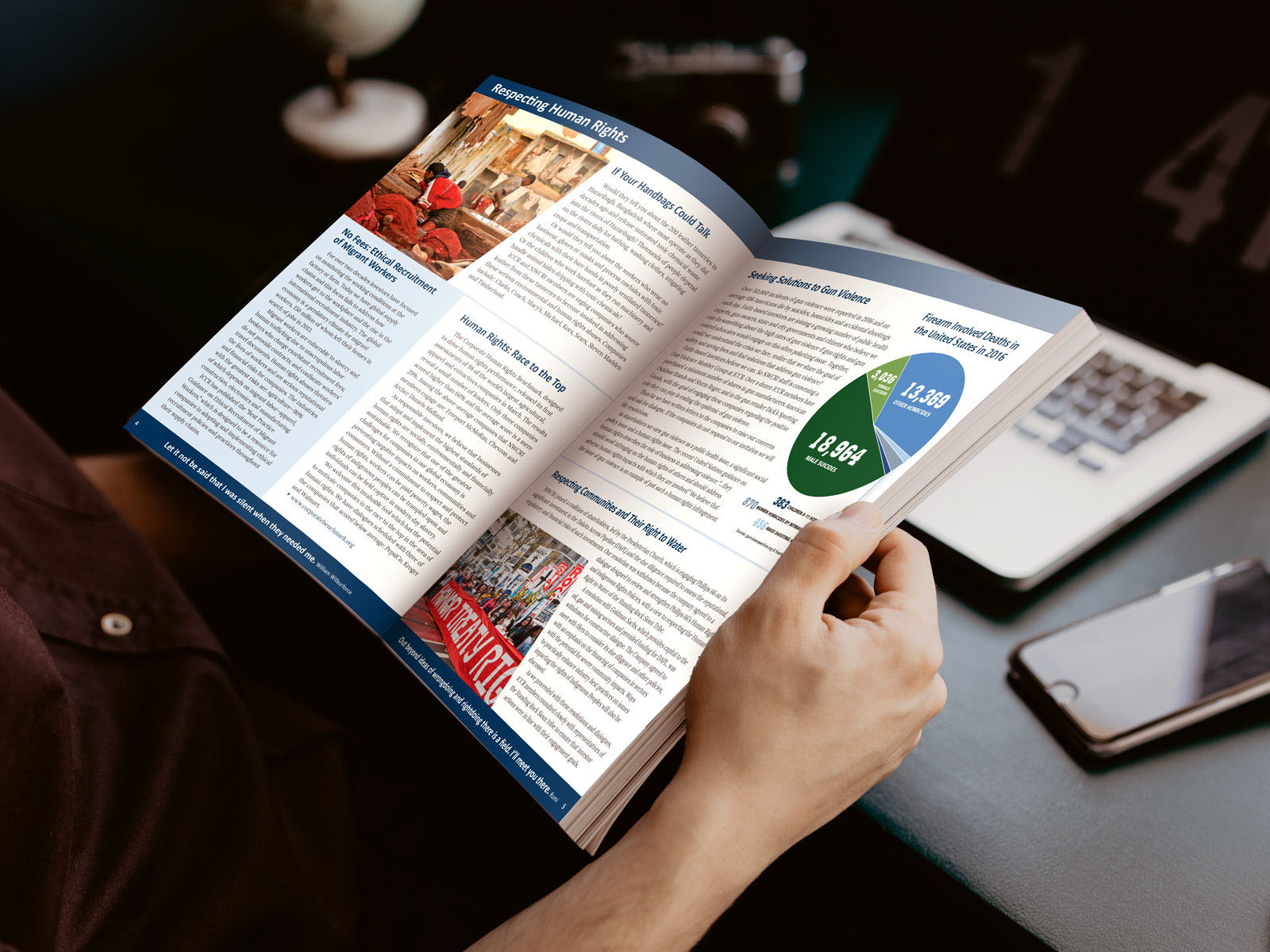 A person holding an open spread of the 2017 NWCRI Annual Report